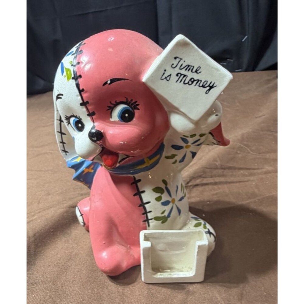 Red & White piggy bank dog holding a sign time is money"